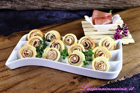 Composizione di stuzzichini a base di pasta sfoglia