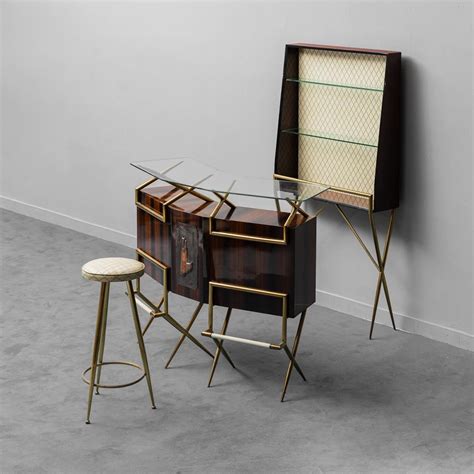 Mobile bar in metallo con dettagli in ottone e vetro